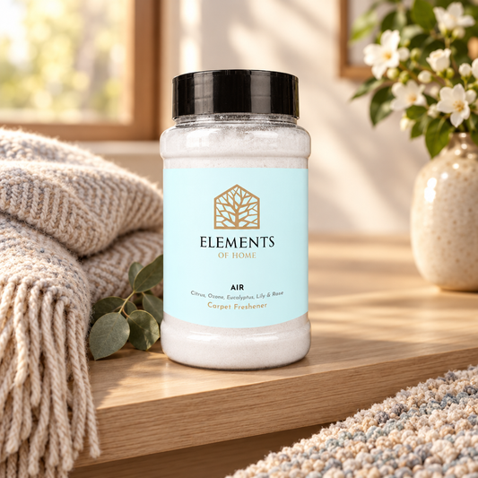 Air scented carpet sprinkles shaker tub on a wooden shelf with cosy throws – Elements of Fragrance