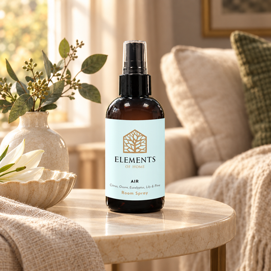Air room spray on a side table in a sunlit living room – Elements of Fragrance