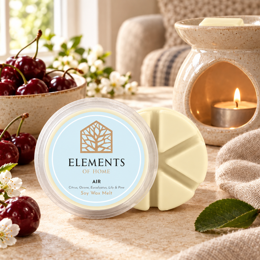 Air 50g soy wax melt snap pot beside a lit ceramic wax burner – Elements of Fragrance