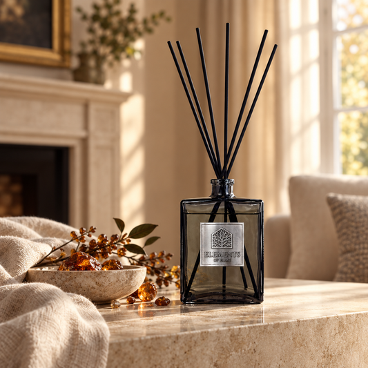 Amber Flame 500ml luxury reed diffuser in a black glass bottle styled in a sunlit living room – Elements of Fragrance
