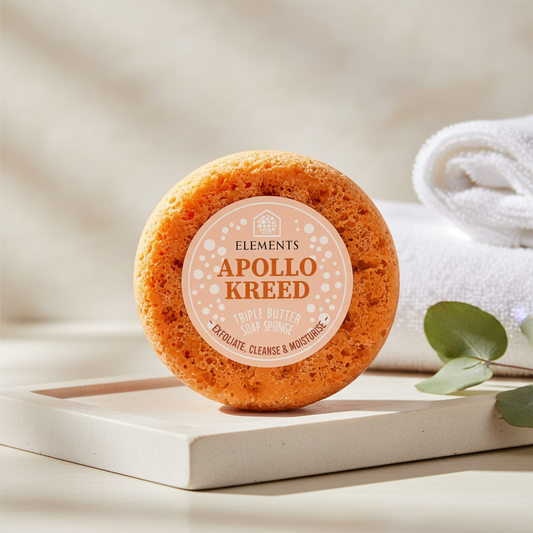 Apollo triple butter soap sponge on a bathroom shelf with white towels – Elements of Fragrance