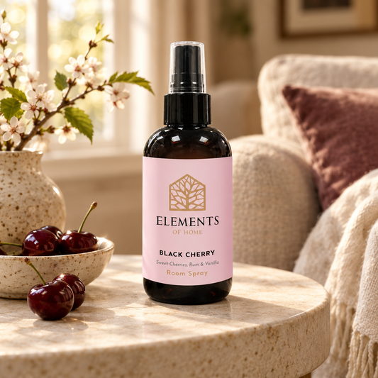 Black Cherry room spray on a side table in a sunlit living room – Elements of Fragrance