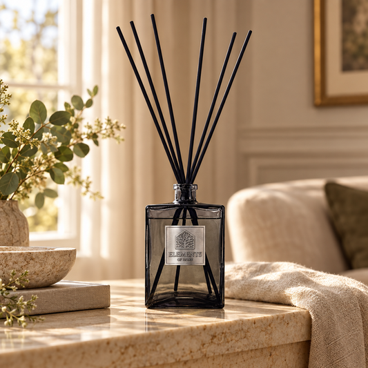 Crystal Sky 1L luxury reed diffuser in a black glass bottle styled in a sunlit living room – Elements of Fragrance
