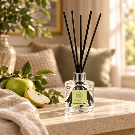 Green Apple & Pear 100ml reed diffuser with black reeds styled in a sunlit living room – Elements of Fragrance