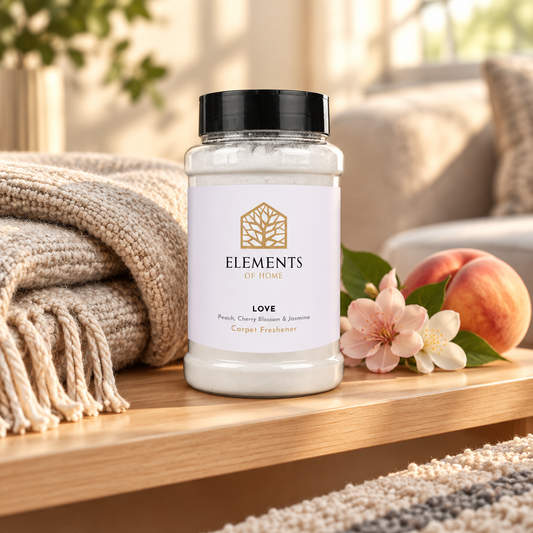 Love scented carpet sprinkles shaker tub on a wooden shelf with cosy throws – Elements of Fragrance