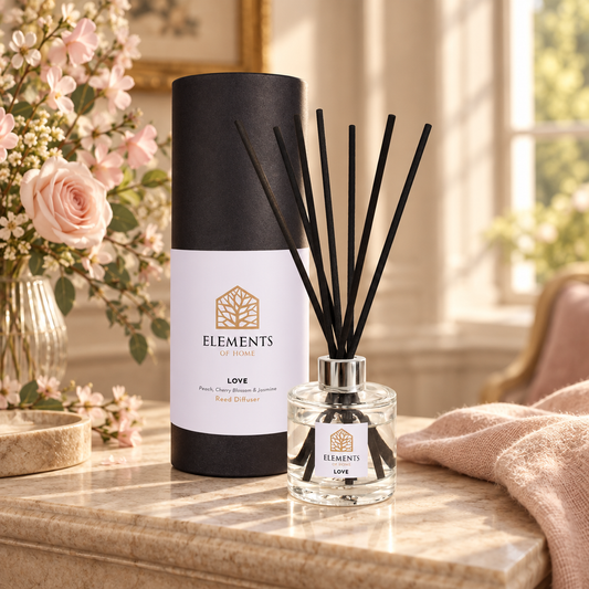Love 100ml reed diffuser with black reeds styled in a sunlit living room – Elements of Fragrance