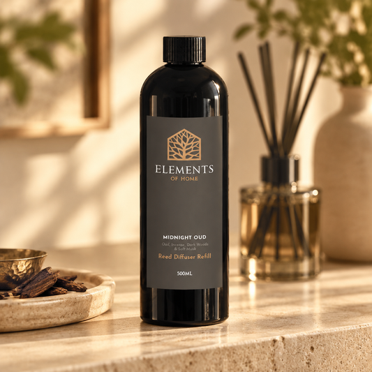 Midnight Oud 500ml reed diffuser refill bottle beside a reed diffuser – Elements of Fragrance
