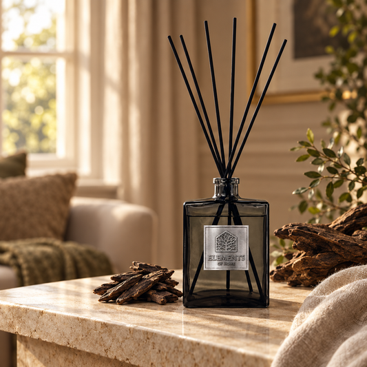 Midnight Oud 500ml luxury reed diffuser in a black glass bottle styled in a sunlit living room – Elements of Fragrance