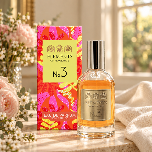 No03 Inspired by La Vie Est Belle 50ml eau de parfum styled on a marble table in a sunlit room – Elements of Fragrance