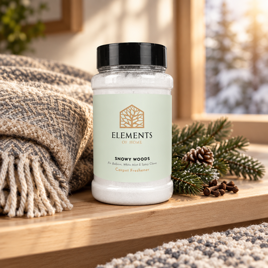 Snowy Woods scented carpet sprinkles shaker tub on a wooden shelf with cosy throws – Elements of Fragrance