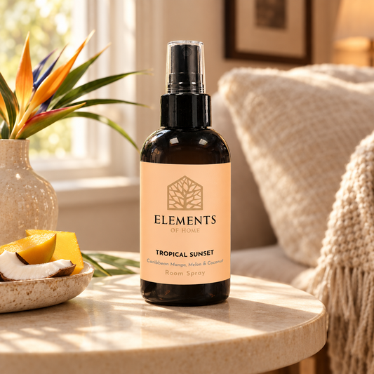 Tropical Sunset room spray on a side table in a sunlit living room – Elements of Fragrance