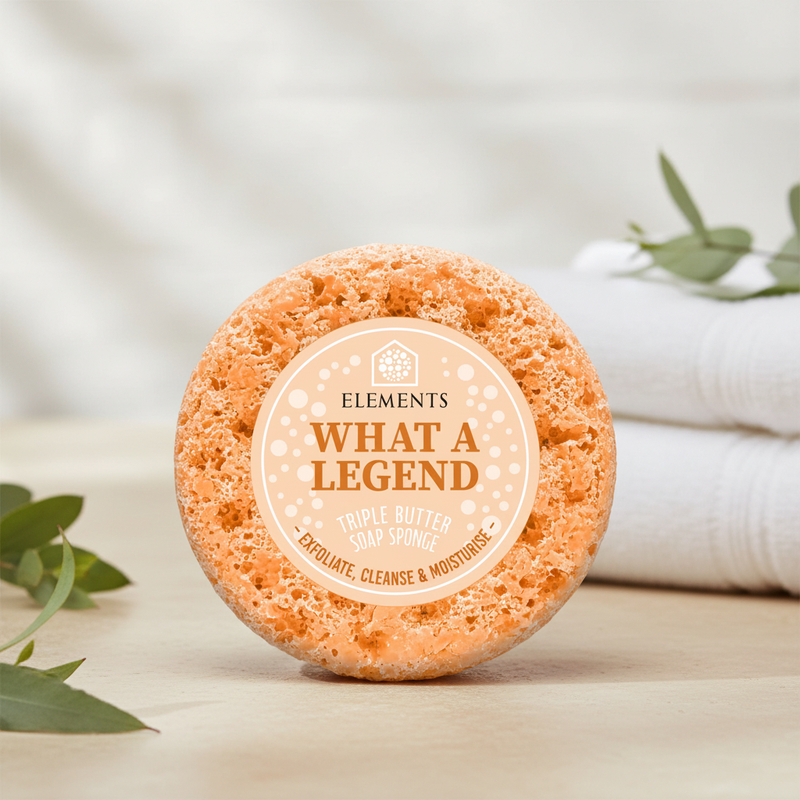 What a Legend triple butter soap sponge on a bathroom shelf with white towels – Elements of Fragrance