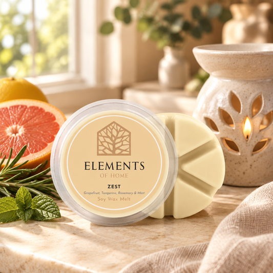Zest 50g soy wax melt snap pot beside a lit ceramic wax burner – Elements of Fragrance