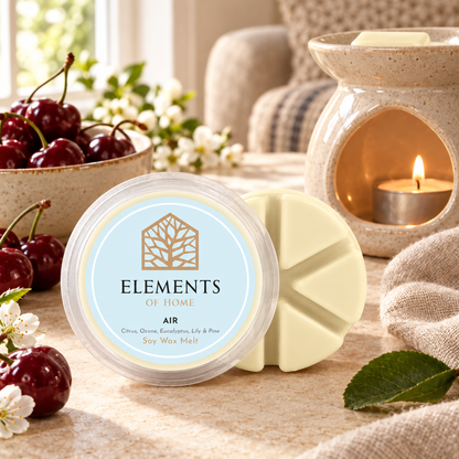 Air 50g soy wax melt snap pot beside a lit ceramic wax burner – Elements of Fragrance