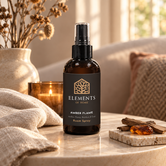 Amber Flame 150ml room spray on a side table in a sunlit living room – Elements of Fragrance