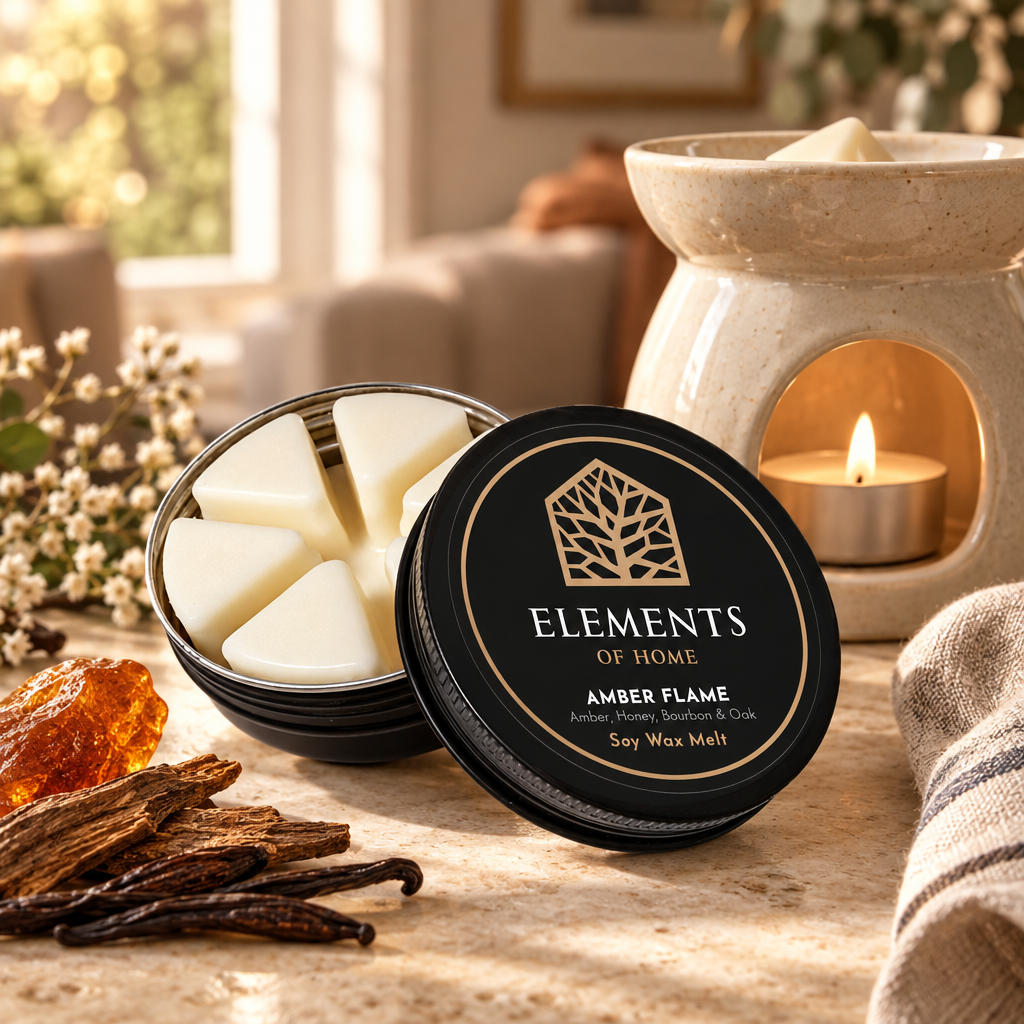 Amber Flame 50g soy wax melt in a black tin beside a lit ceramic wax burner – Elements of Fragrance
