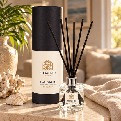 Beach Paradise 100ml reed diffuser with black reeds styled in a sunlit living room – Elements of Fragrance