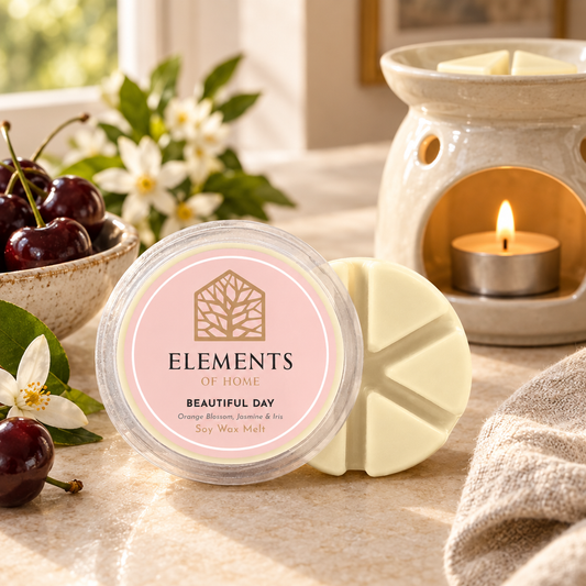 Beautiful Day 50g soy wax melt snap pot beside a lit ceramic wax burner – Elements of Fragrance