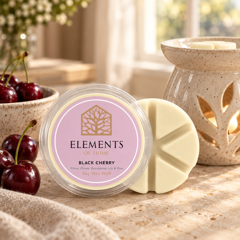 Black Cherry 50g soy wax melt snap pot beside a lit ceramic wax burner – Elements of Fragrance