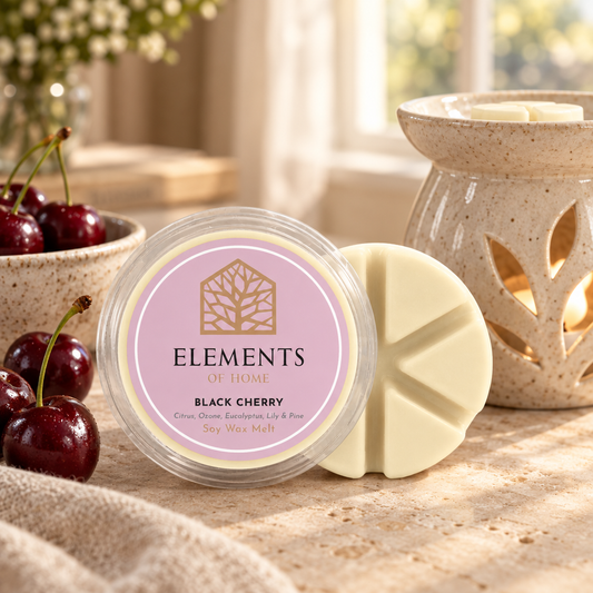 Black Cherry 50g soy wax melt snap pot beside a lit ceramic wax burner – Elements of Fragrance