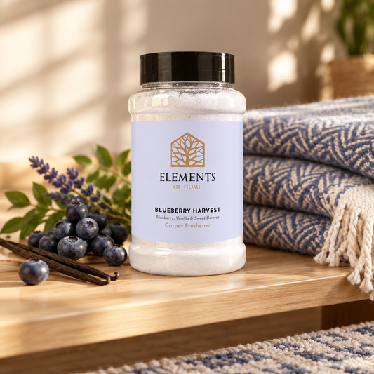 Blueberry Harvest scented carpet sprinkles shaker tub on a wooden shelf with cosy throws – Elements of Fragrance