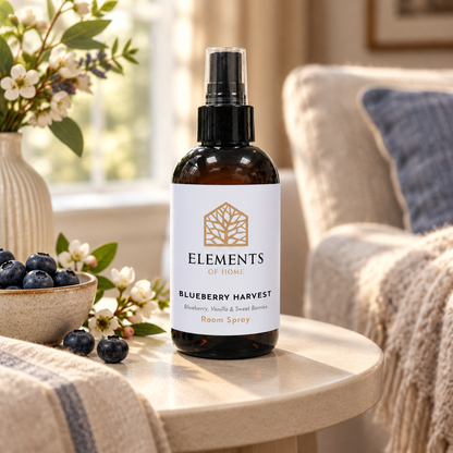 Blueberry Harvest room spray on a side table in a sunlit living room – Elements of Fragrance