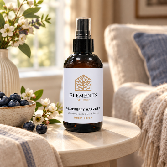 Blueberry Harvest room spray on a side table in a sunlit living room – Elements of Fragrance