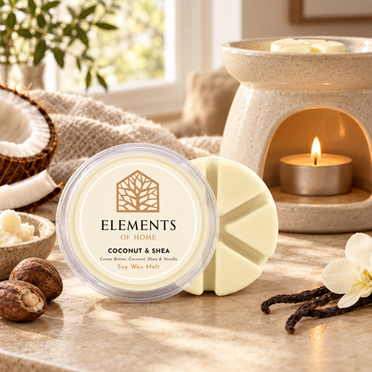 Coconut & Shea 50g soy wax melt snap pot beside a lit ceramic wax burner – Elements of Fragrance