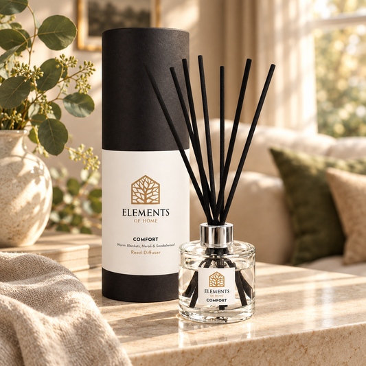 Comfort 100ml reed diffuser with black reeds styled in a sunlit living room – Elements of Fragrance