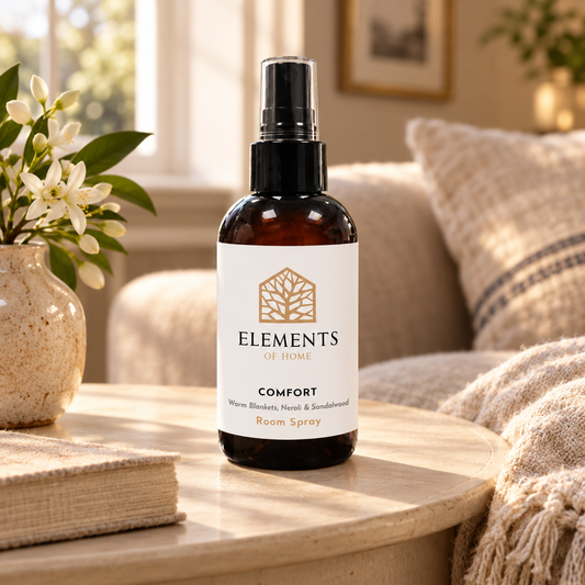 Comfort room spray on a side table in a sunlit living room – Elements of Fragrance