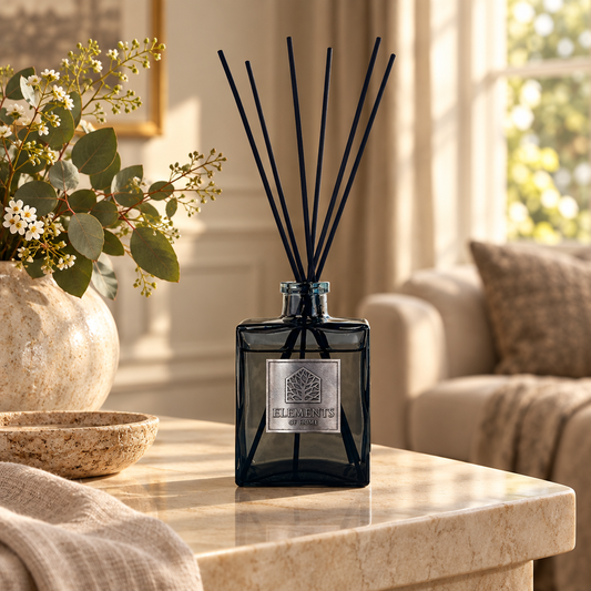 Cosmos 200ml luxury reed diffuser in a black glass bottle styled in a sunlit living room – Elements of Fragrance