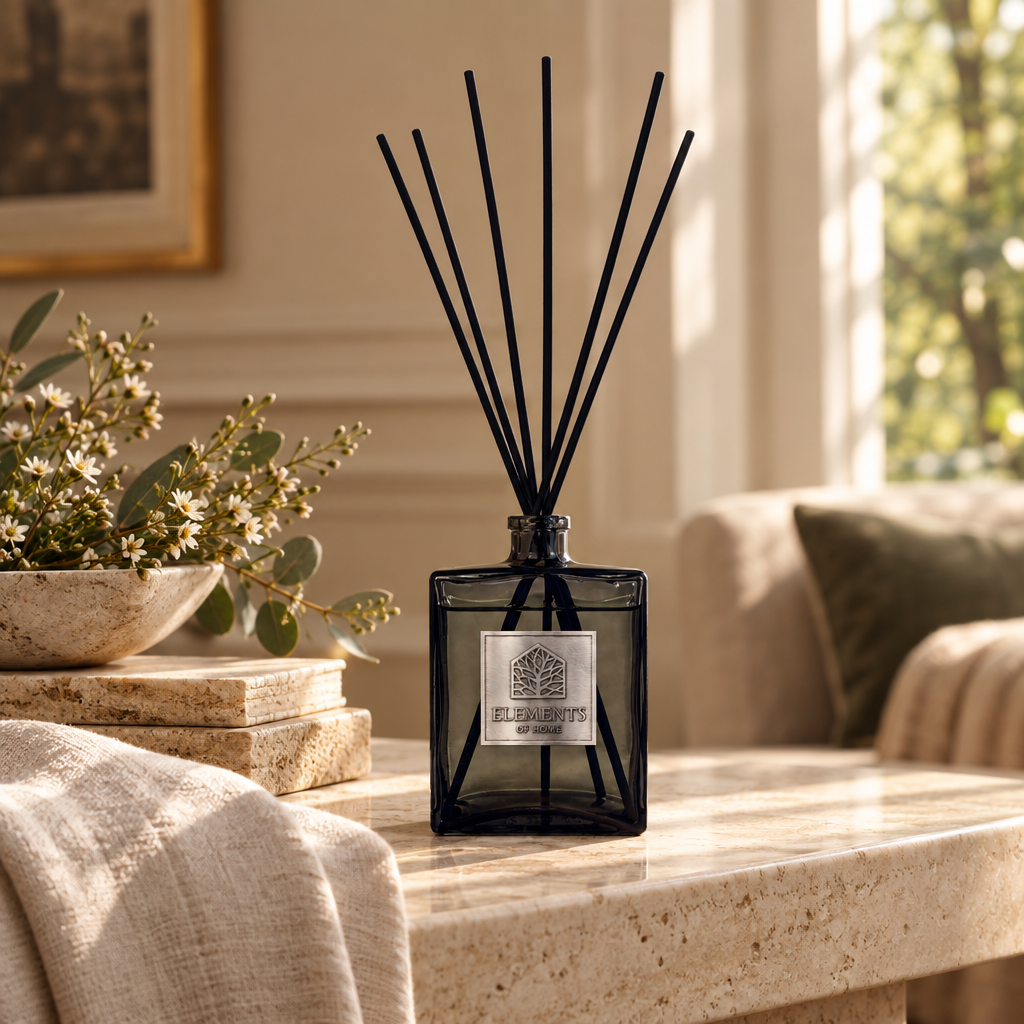 Cosmos 500ml luxury reed diffuser in a black glass bottle styled in a sunlit living room – Elements of Fragrance