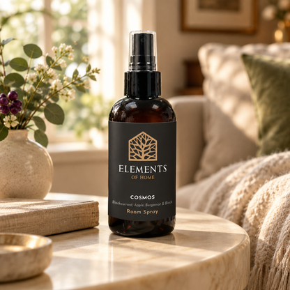 Cosmos 150ml room spray on a side table in a sunlit living room – Elements of Fragrance