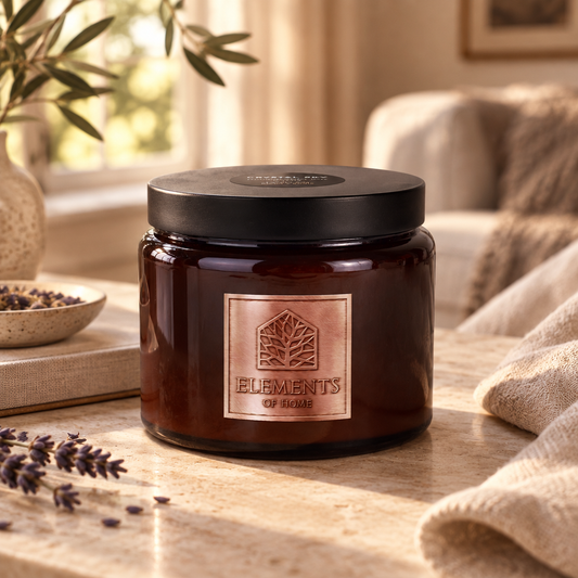 Crystal Sky 413g luxury candle in an amber glass jar in a cosy living room – Elements of Fragrance