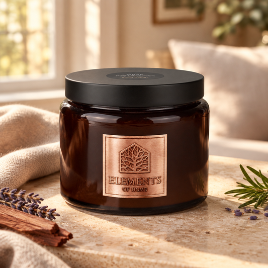 Dusk 413g luxury candle in an amber glass jar in a cosy living room – Elements of Fragrance