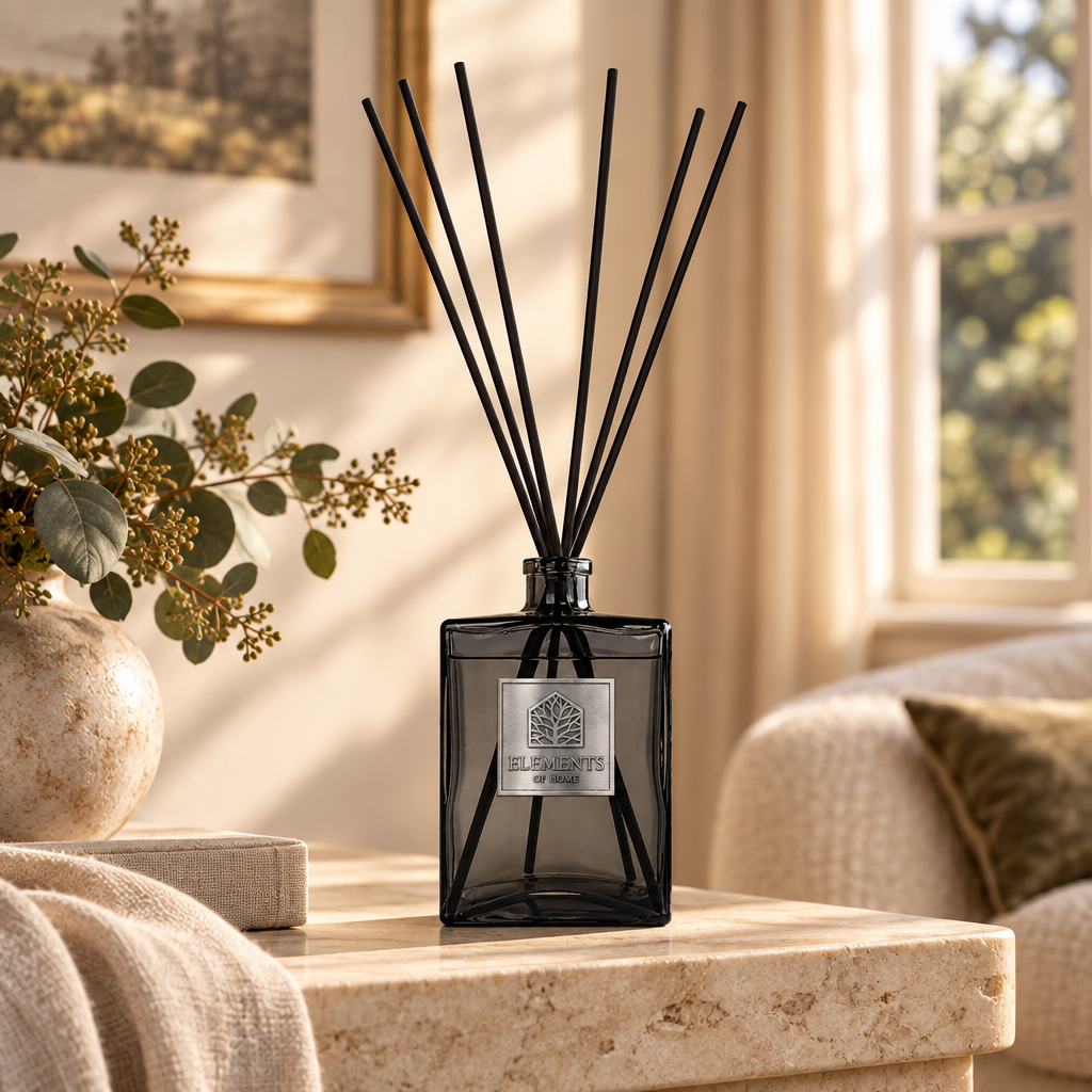Dusk 1L luxury reed diffuser in a black glass bottle styled in a sunlit living room – Elements of Fragrance