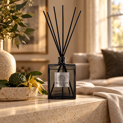 Dusk 500ml luxury reed diffuser in a black glass bottle styled in a sunlit living room – Elements of Fragrance