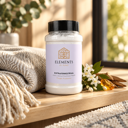 Extraterrestrial scented carpet sprinkles shaker tub on a wooden shelf with cosy throws – Elements of Fragrance