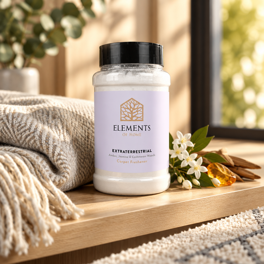 Extraterrestrial scented carpet sprinkles shaker tub on a wooden shelf with cosy throws – Elements of Fragrance