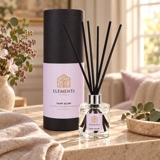 Fairy Glow 100ml reed diffuser with black reeds styled in a sunlit living room – Elements of Fragrance
