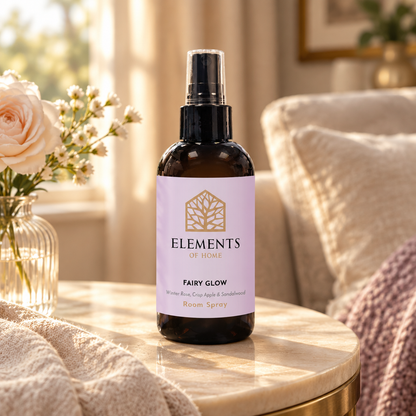 Fairy Glow room spray on a side table in a sunlit living room – Elements of Fragrance