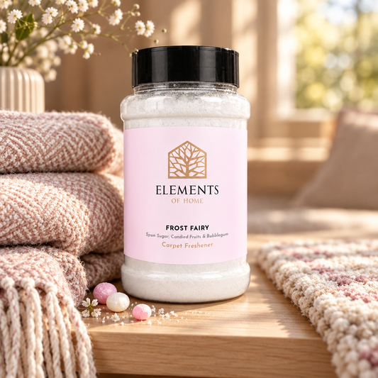 Frost Fairy scented carpet sprinkles shaker tub on a wooden shelf with cosy throws – Elements of Fragrance