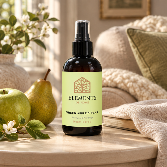Green Apple & Pear room spray on a side table in a sunlit living room – Elements of Fragrance