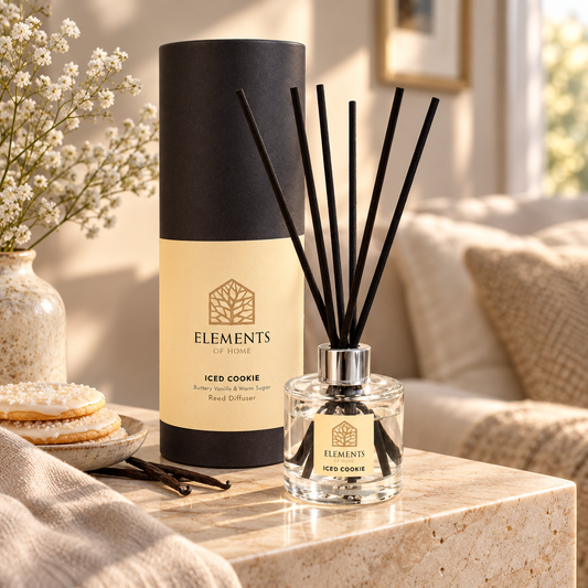 Iced Cookie 100ml reed diffuser with black reeds styled in a sunlit living room – Elements of Fragrance
