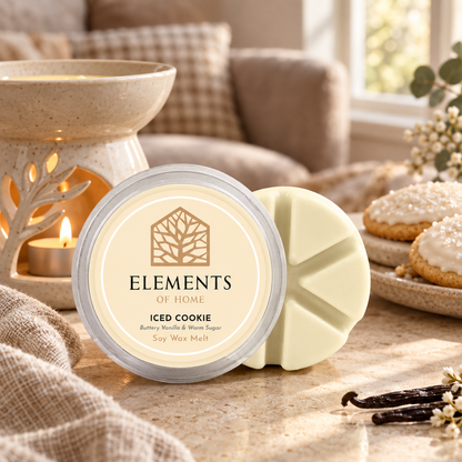 Iced Cookie 50g soy wax melt snap pot beside a lit ceramic wax burner – Elements of Fragrance