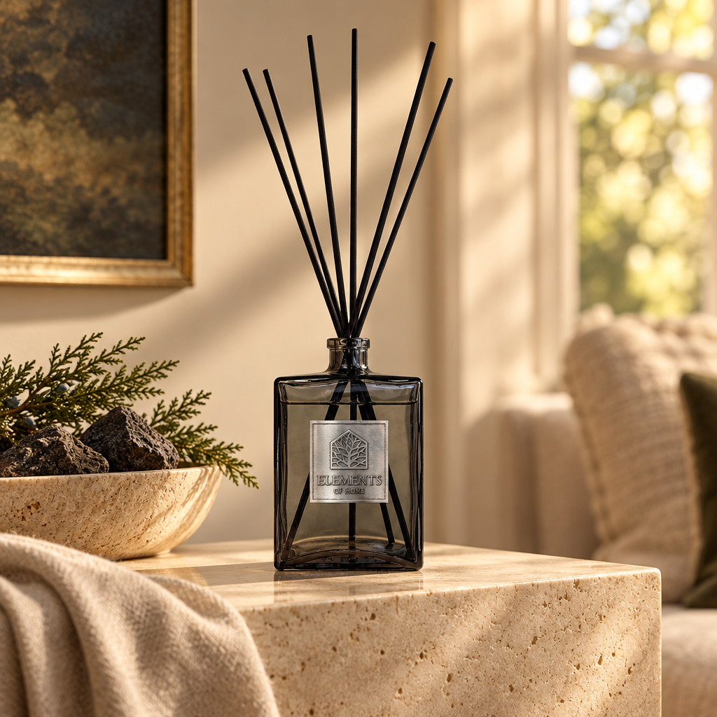 Igneous 500ml luxury reed diffuser in a black glass bottle styled in a sunlit living room – Elements of Fragrance