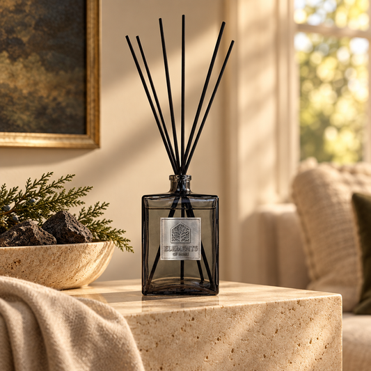 Igneous 500ml luxury reed diffuser in a black glass bottle styled in a sunlit living room – Elements of Fragrance