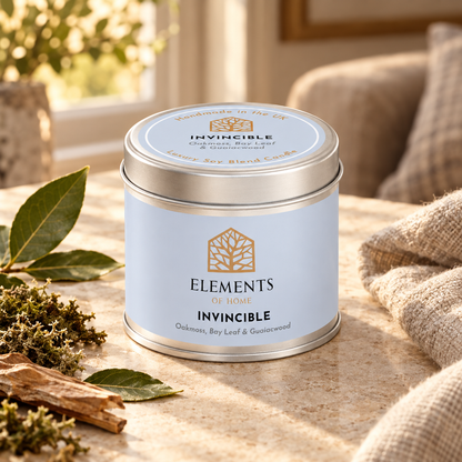 Invincible scented candle in a 180g tin styled with fresh ingredients – Elements of Fragrance