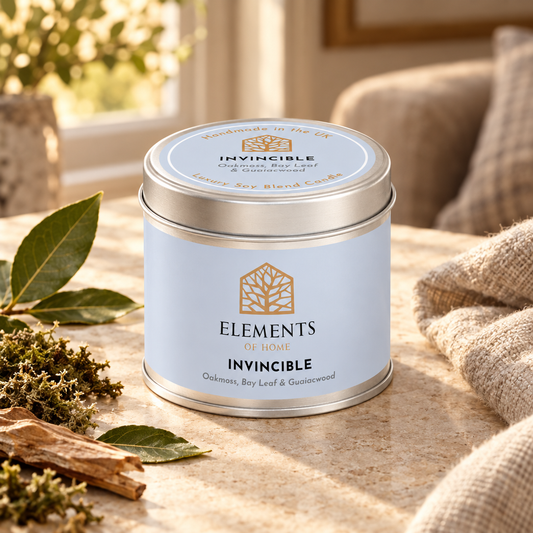 Invincible scented candle in a 180g tin styled with fresh ingredients – Elements of Fragrance