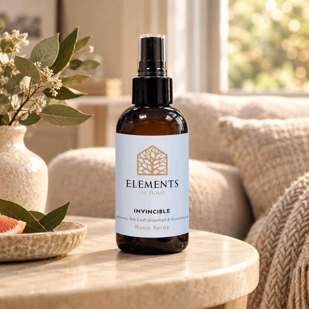 Invincible room spray on a side table in a sunlit living room – Elements of Fragrance